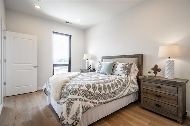 bedroom featuring light hardwood / wood-style floors