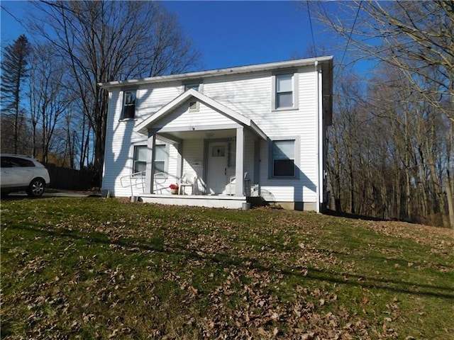 front facade with a porch and a front yard