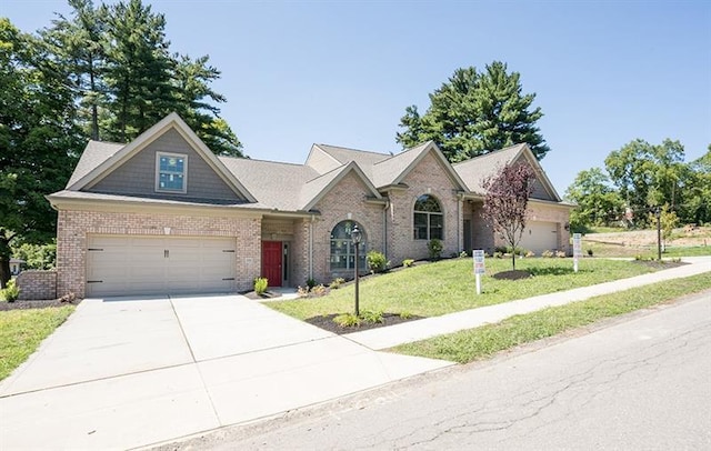 single story home with a front yard and a garage