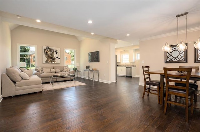 living room featuring an inviting chandelier and dark wood-type flooring