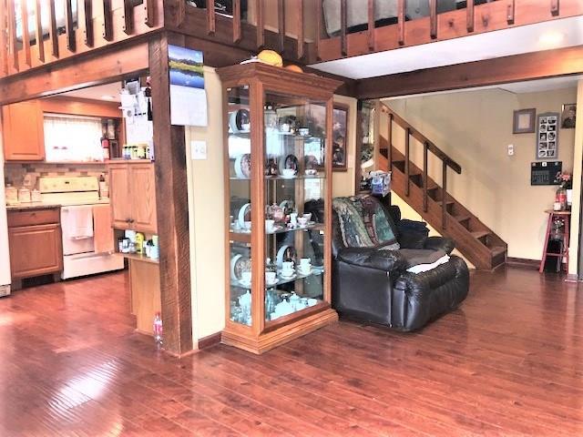 living room with dark hardwood / wood-style floors