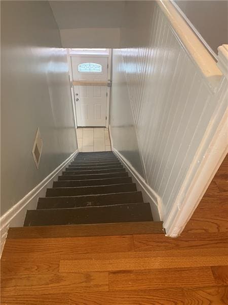 stairway featuring tile floors