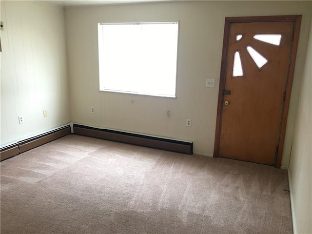 view of carpeted foyer entrance