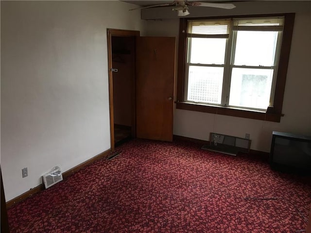 carpeted empty room with ceiling fan