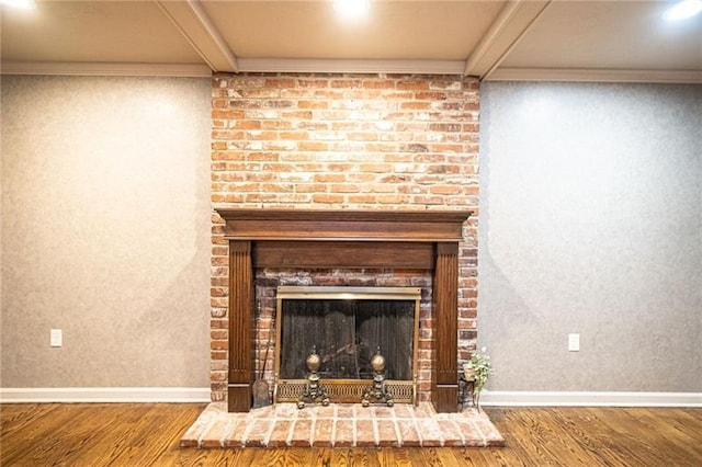 details with dark wood-type flooring and a brick fireplace