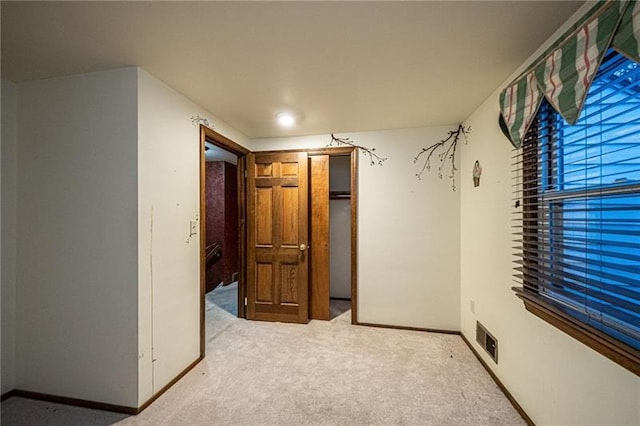 unfurnished bedroom with light carpet