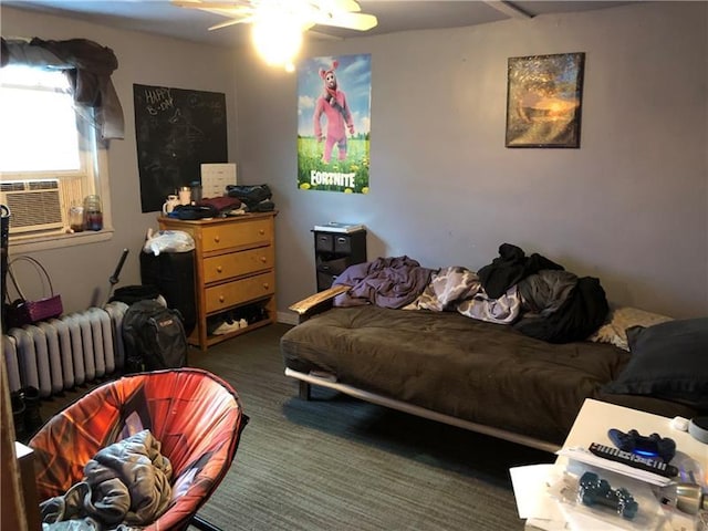 bedroom with ceiling fan and radiator