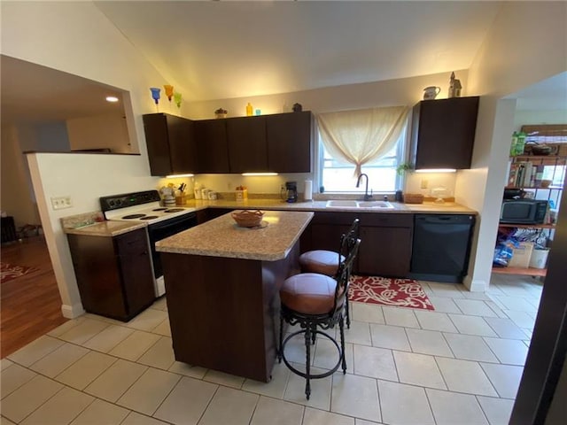 kitchen featuring a kitchen bar, vaulted ceiling, dishwasher, white electric range, and sink