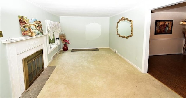 interior space with ornamental molding and light hardwood / wood-style floors