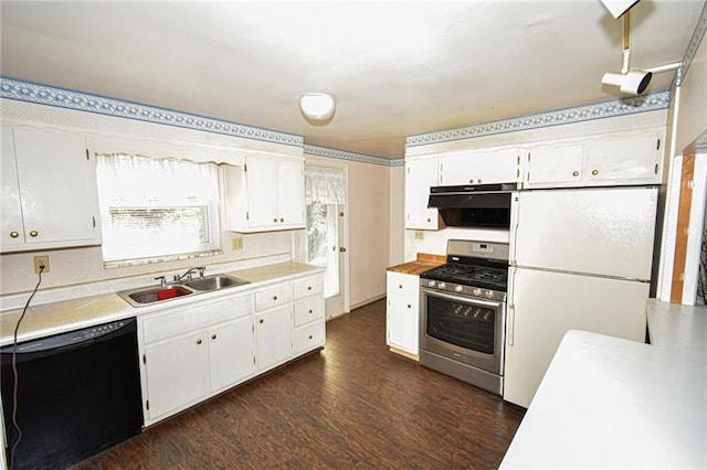 kitchen featuring dark wood-type flooring, white fridge, white cabinetry, gas range, and dishwasher