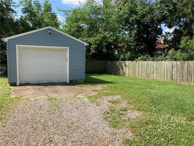 garage featuring a lawn