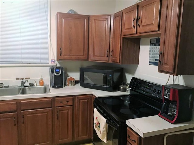 kitchen featuring black appliances and sink