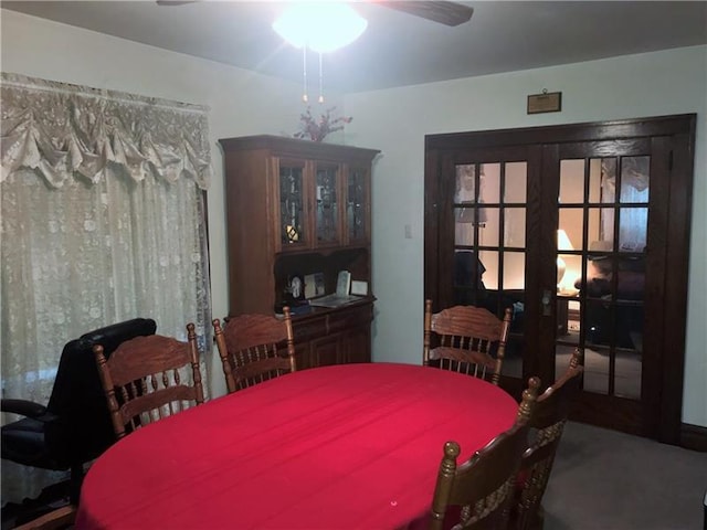 dining space featuring french doors and ceiling fan