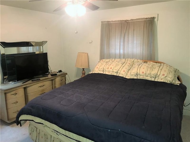 bedroom featuring ceiling fan and light colored carpet