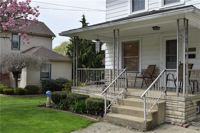 view of exterior entry featuring a porch