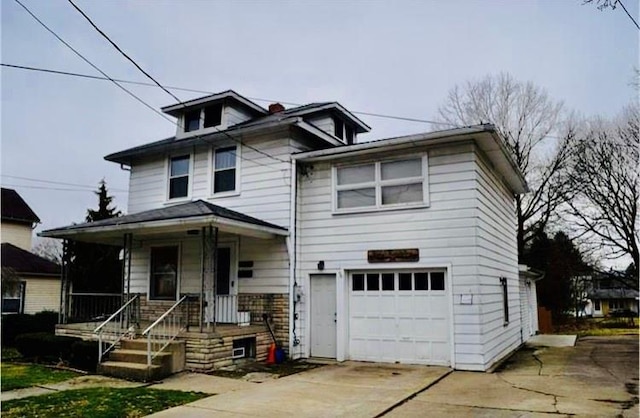 front of property with covered porch and a garage