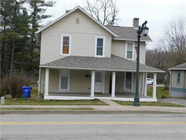 farmhouse featuring a porch