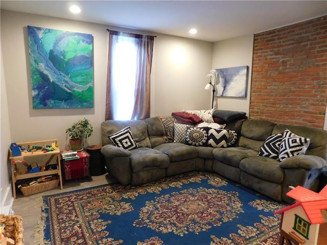 living room with brick wall