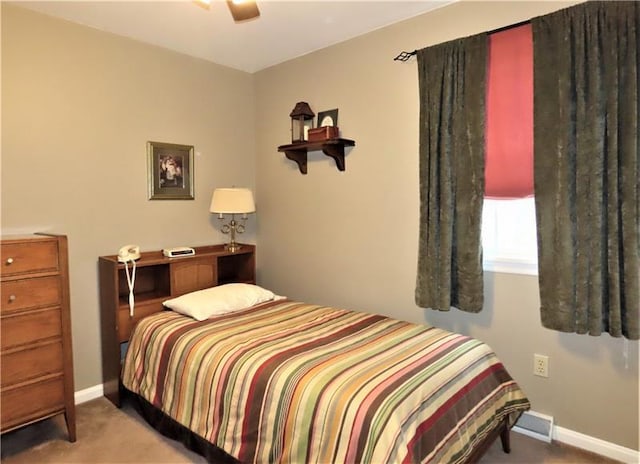 bedroom featuring ceiling fan and carpet floors