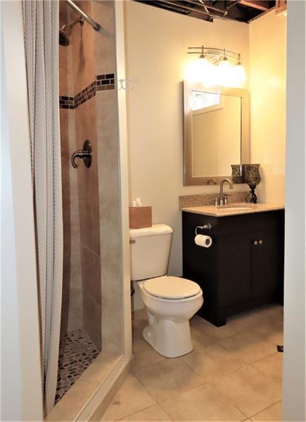 bathroom with walk in shower, tile flooring, toilet, and vanity