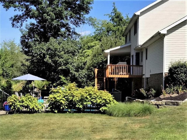 view of yard featuring a wooden deck