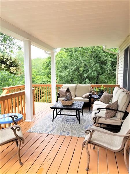 wooden deck with an outdoor living space