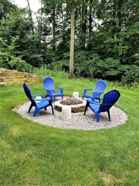 view of yard with an outdoor fire pit