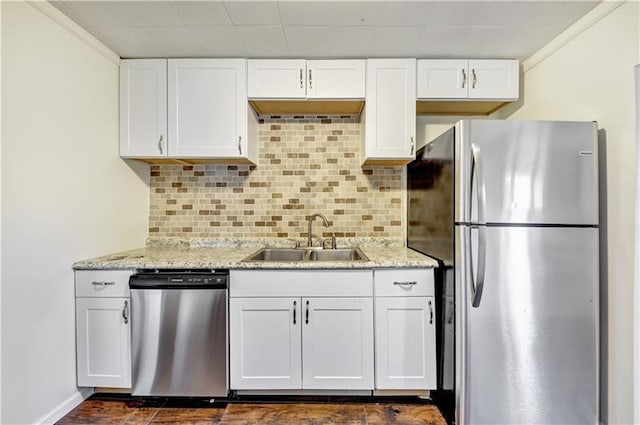 kitchen with white cabinets, sink, and stainless steel appliances