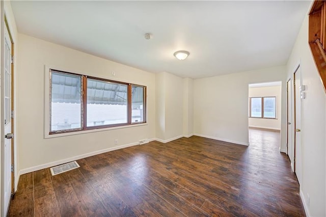 empty room featuring dark hardwood / wood-style floors