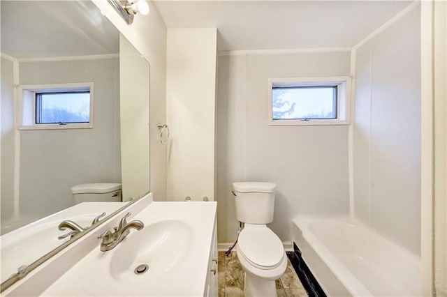 full bathroom featuring toilet, a healthy amount of sunlight, and vanity