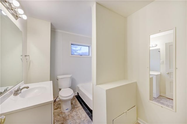 bathroom with toilet, large vanity, and tile floors