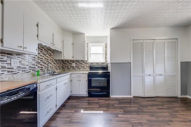 kitchen featuring dark hardwood / wood-style flooring, white cabinetry, electric range, dishwasher, and sink