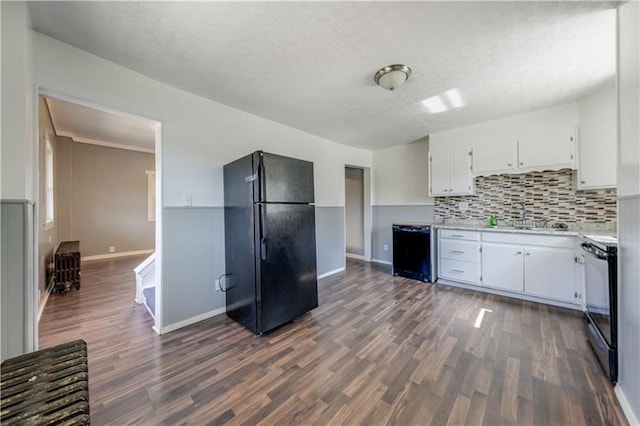 kitchen with white cabinets, dark wood-type flooring, and black appliances