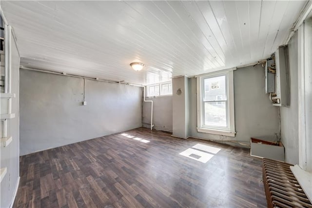 empty room with dark hardwood / wood-style flooring