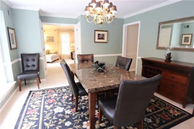 carpeted dining room with a notable chandelier and ornamental molding