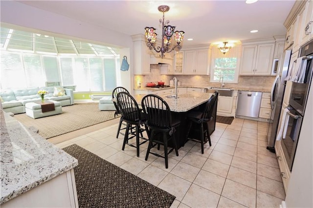 interior space featuring sink and an inviting chandelier