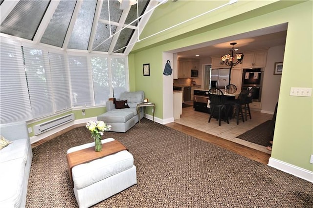 sunroom / solarium featuring a notable chandelier and a baseboard radiator