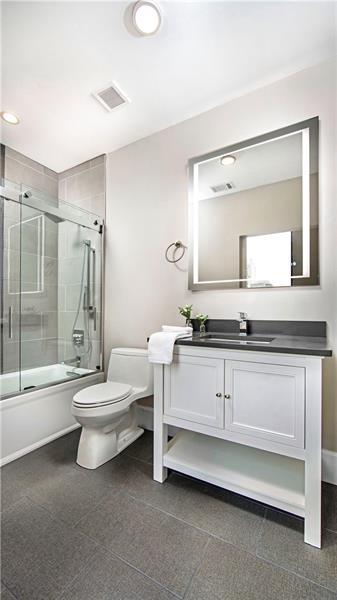 full bathroom with toilet, vanity, shower / bath combination with glass door, and tile flooring