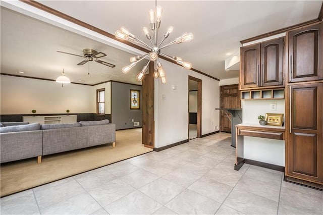 interior space featuring crown molding, ceiling fan with notable chandelier, light colored carpet, and dark brown cabinetry