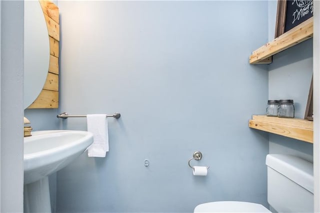 bathroom with sink and toilet