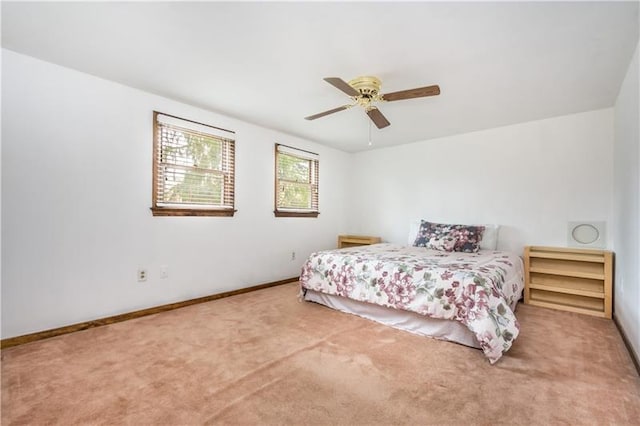 bedroom featuring light carpet and ceiling fan