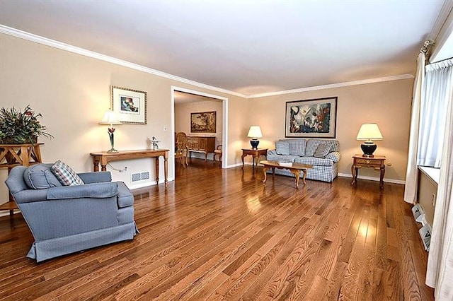 living room with ornamental molding and dark hardwood / wood-style floors