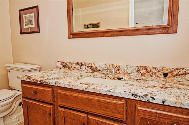 bathroom with toilet and oversized vanity