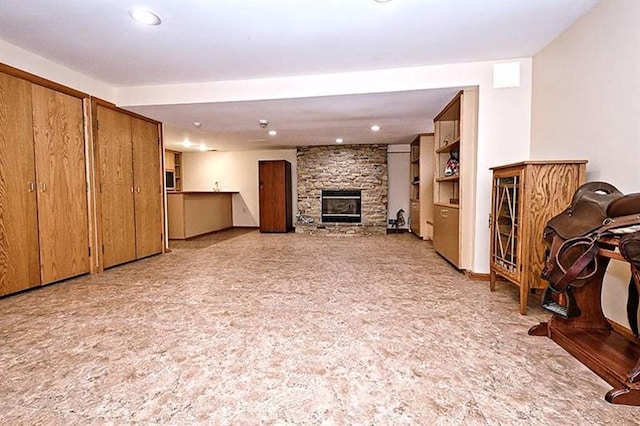 unfurnished living room featuring light colored carpet and a fireplace