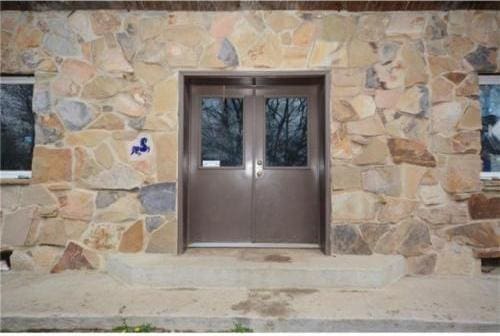 view of exterior entry featuring french doors