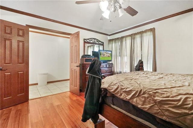 bedroom with crown molding, ceiling fan, and light wood-type flooring