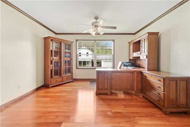 unfurnished office featuring ceiling fan, crown molding, and light hardwood / wood-style floors