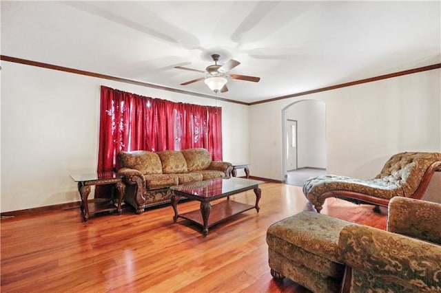 living room with ceiling fan and light hardwood / wood-style floors