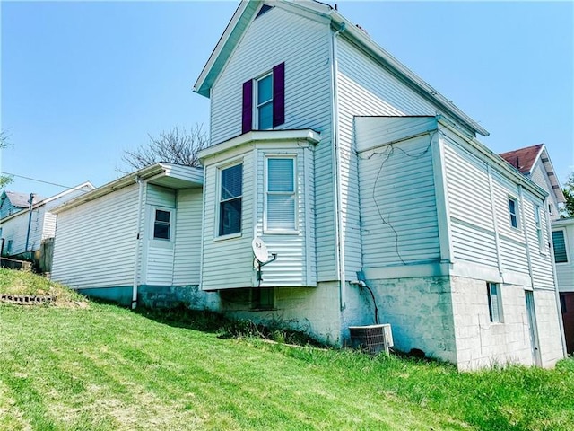 rear view of house with a lawn