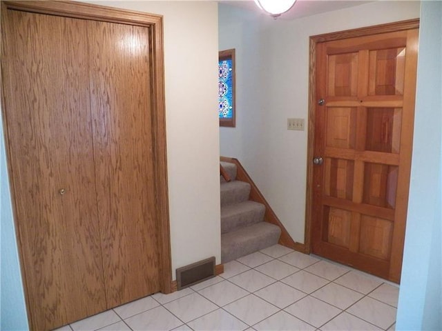 entrance foyer with light tile flooring